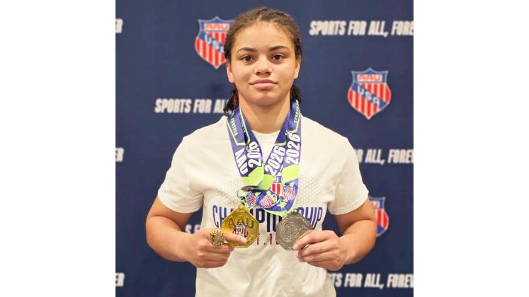 Recent Columbia graduate Bella Guerrier-Lajoir shows off her medals after going 8-0 to earn All-American honors at the AAU Scholastic Duals over the weekend. (COURTESY)