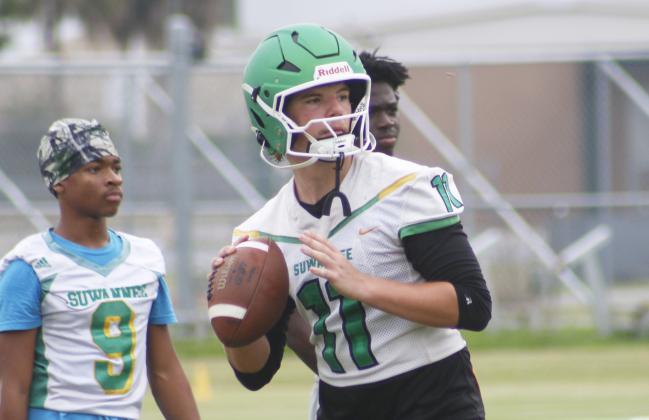 Suwannee quarterback Haigen Johnson drops back to pass during practice on Monday. (JAMIE WACHTER/Lake City Reporter)