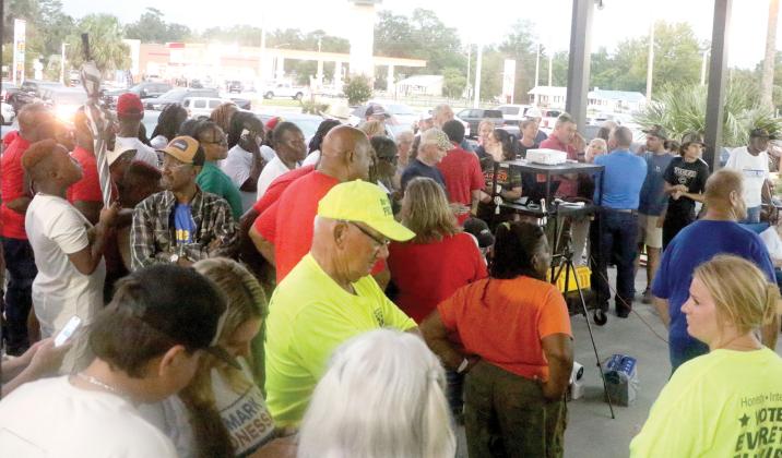 Candidates, supporters and other interested local residents wait outside the Supervisor of Elections Office on Tuesday night for results to come in from the primary election. (MORGAN MCMULLEN/Lake City Reporter)