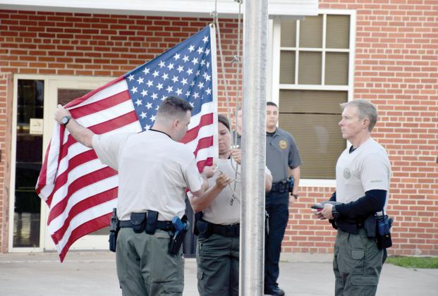Florida Gateway College students raise the flag at the FGC Public Safety Training Center in Olustee. The college has been designated a Purple Star Campus by the Florida Department of Education for service and commitment to supporting military students and families. (COURTESY FLORIDA GATEWAY COLLEGE)