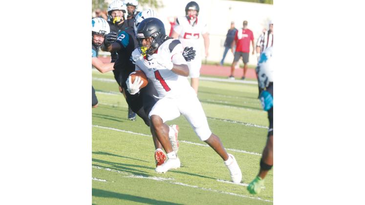 Fort White running back John’l Lawson races up the field for a long run against Providence during the Kickoff Classic on Aug. 14. Lawson is a key returner on offense for the Indians this season. (MORGAN MCMULLEN/Lake City Reporter)