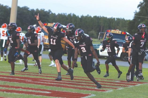 Fort White safety Marvion Wallace (2) celebrates with his teammates after his first interception return for a touchdown against Eastside on Friday. (MORGAN MCMULLEN/Lake City Reporter)
