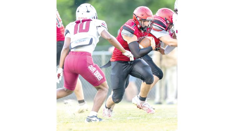 Lafayette running back Trevor Byrd powers ahead against Madison County in the teams’ spring game. (JACK HOWDESHELL/Lake City Reporter)