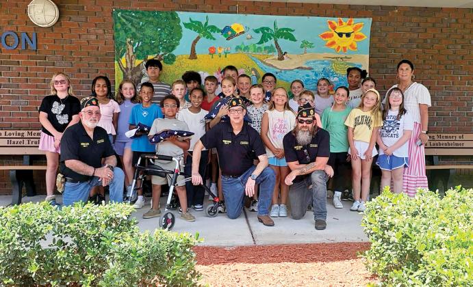 Members of the American Legion Post 57 Honor Guard of Lake City visited Amy Kirkland Smith’s fifth-grade Safety Patrol class Wednesday at Westside Elementary School to provide a lesson on American Flag etiquette. (COURTESY)