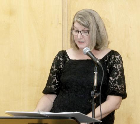 Columbia County Public Library Director Katrina Evans speaks during a previous graduation ceremony for College Online High School students through the library. The program is being relaunched thanks to a a partnership between COHS and Friends of the Library. (FILE)