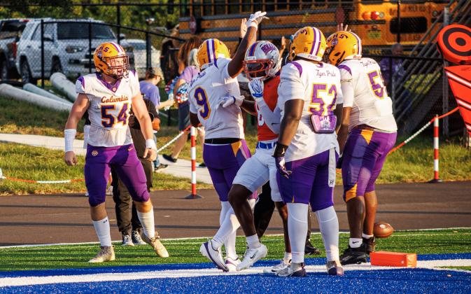 Columbia right tackle Xander Satterfield celebrates with teammates after scoring a touchdown against Bolles on Friday. (JAMARION WEST/Special to the Reporter)