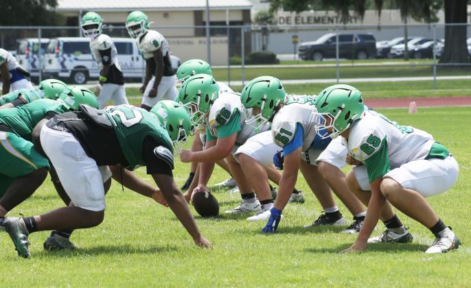 Suwannee’s offensive line gets set for a snap against the defense during Monday’s practice. (JAMIE WACHTER/Lake City Reporter)