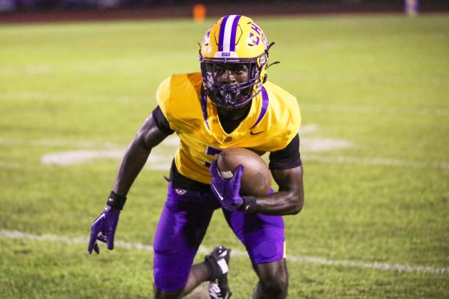 Columbia receiver Kyren Caldwell turns upfield after a catch against Riverside last Friday. (BRENT KUYKENDALL/Lake City Reporter)