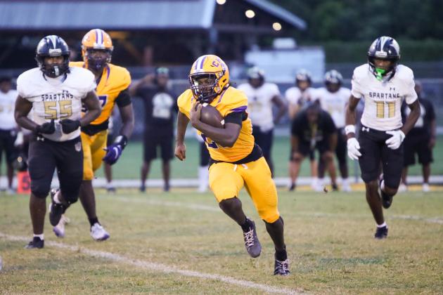 Columbia running back Jerome Horne gets around the corner of the Lakewood defense for a gain on Friday. (BRENT KUYKENDALL/Lake City Reporter)