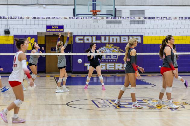 Lafayette delivers a deep serve out of bounds to give Columbia match point in a sweep Monday night. (JACK HOWDESHELL/Lake City Reporter)