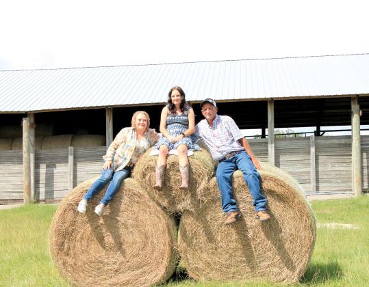 The Errol Buchanan family (Errol, Felecia, and Tanya) was named the Lafayette County Farm Family of the Year by the Lafayette County Farm Bureau. (COURTESY)