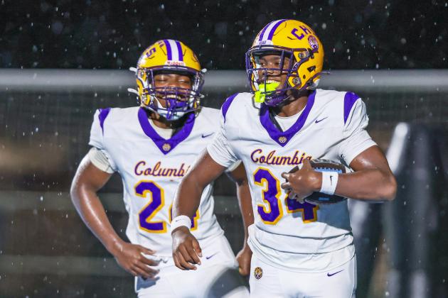 Columbia defensive end Mikel Morgan (34) celebrates after scoring a touchdown off a blocked punt by defensive end Jae’quan Wilson during Friday’s 49-0 win over Ribault. (GARY LLOYD MCCULLOUGH/Special to the Reporter)