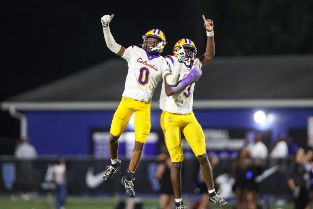 Columbia defensive back Mekah Combs-Turner (0) celebrates with defensive back Monterrence Williamson after one of his two turnovers against Trinity Christian on Friday. (GARY LLOYD MCCULLOUGH/Special to the Reporter)