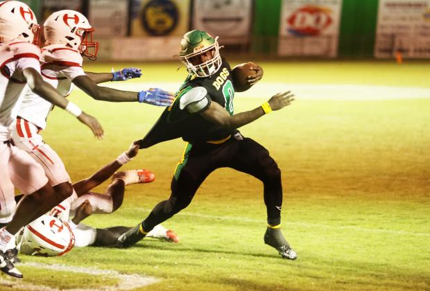 Suwannee running back Travon Fead tries to escape a tackle from Hamilton County last Friday. (PAUL BUCHANAN/Lake City Reporter)