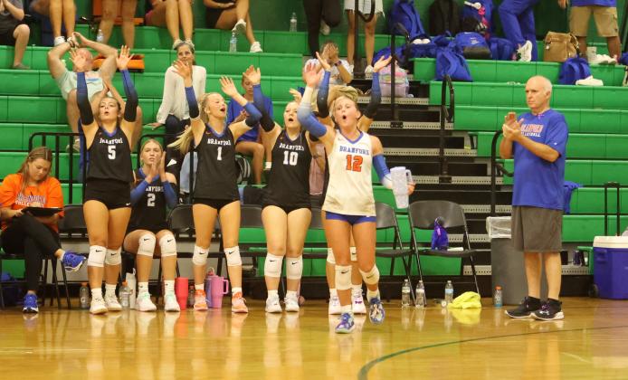 Branford's bench celebrates a point against Suwannee on Aug. 18. (PAUL BUCHANAN/Lake City Reporter)