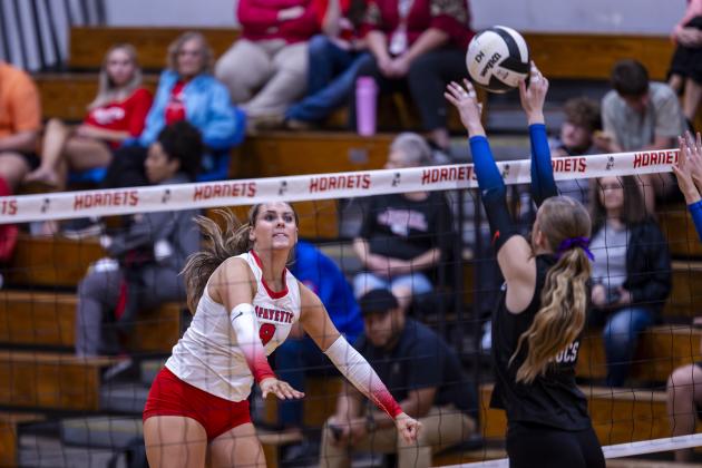 Lafayette middle hitter Sophia Kendrick sends a shot over the net against Branford on Aug. 27. (JACK HOWDESHELL/Lake City Reporter)
