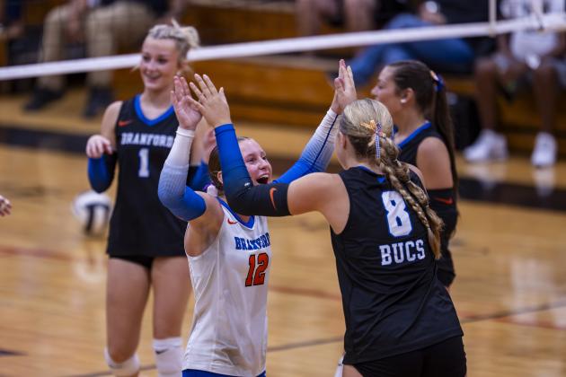 Branford libero Ava Alcorn (12) high fives hitter Anabella Dicks (8) during a win over Lafayette on Aug. 27.