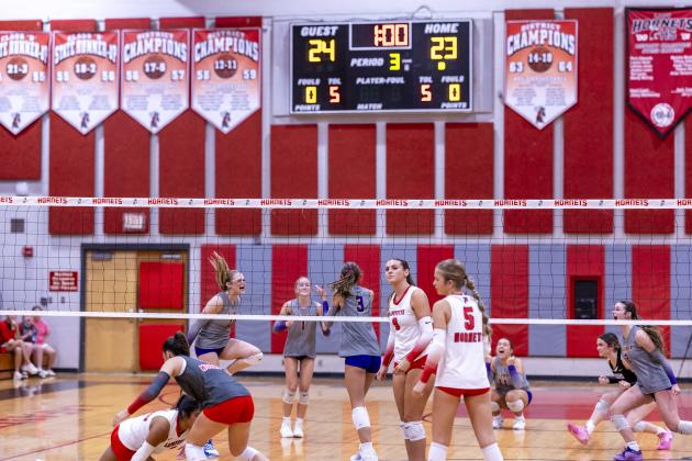 Columbia middle hitter Meleane Wood (3) and her teammates celebrate her block of Lafayette's Sophia Kendrick (9) to earn match point in a sweep of Lafayette on Thursday. (JACK HOWDESHELL/Lake City Reporter)