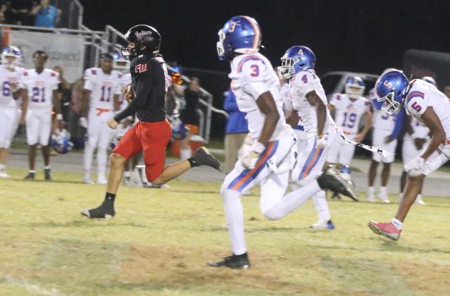 Fort White running back Ezekiel Powell sprints to the end zone for an 83-yard touchdown run and the winning score in Friday’s 27-20 win over Taylor County. (MORGAN MCMULLEN/Lake City Reporter)