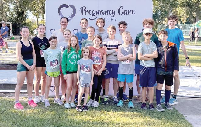 A group of participants in the Pregnancy Care Center’s Walk/Run 4 Life in Live Oak pose for a photo following the run. (COURTESY)