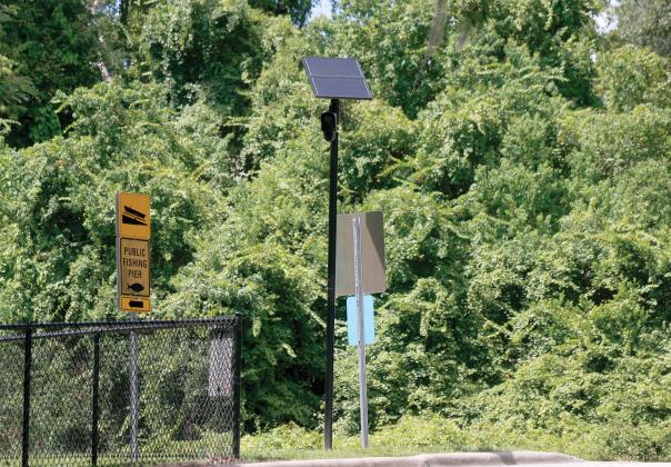 FILE A Flock Safety license plate reader camera sits along Baya Avenue by the entrance to the Lake Montgomery boat ramp. The state is shutting down the use of the cameras on state roads due to privacy concerns. (FILE)