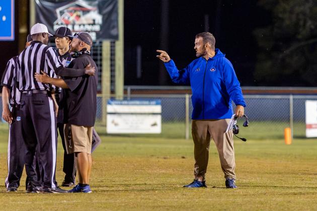 Branford coach Will Dettor (right) and his assistant challenge the referees on a call during a game against Crescent City on Sept. 25. (JACK HOWDESHELL/Lake City Reporter)