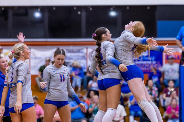 Branford's Adrianna Malaguti (5) celebrates her service ace with Calyssa Dicks (20) during Tuesday's win over Lafayette. (JACK HOWDESHELL/Lake City Reporter)