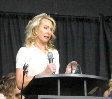 Ashleigh Pitzer, the founder of the Will Carpenter AYA Cancer Foundation, is emotional after the non-profit foundation started in her late son’s honor was named the Suwannee County Chamber of Commerce Non-Profit of the Year. (JAMIE WACHTER/Lake City Reporter)