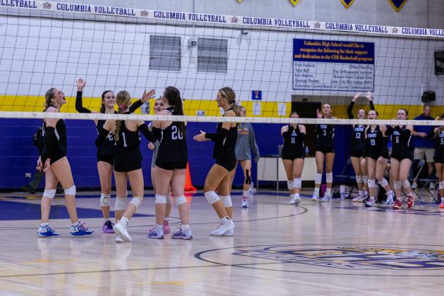 Columbia celebrates winning a set against Baker County on Oct. 8. (JACK HOWDESHELL/Lake City Reporter)