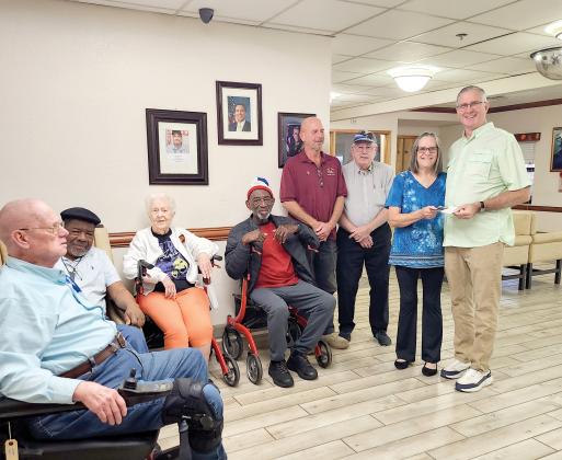 Veterans Robert (Air Force) (from left), Samuel (Navy), Janet DaSilva (Army and Elk member), Tuck (Air Force), John Strayer (ER), Donald Watson (past PDD), Lori Watson (Grant Coordinator) and Ed DaSilva (VA Domicilary Activities Director) were present for the Live Oak Elks Lodge’s donation toward Domiciliary field trips. (COURTESY LIVE OAK ELKS LODGE)