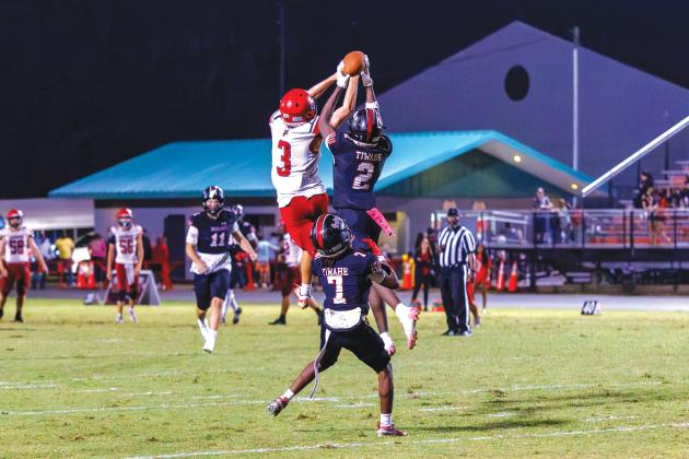 Fort White safety Marvion Wallace (2) picks off a pass intended for Lafayette’s Lane O’Steen before returning it for a touchdown Friday. (JACK HOWDESHELL/Lake City Reporter)