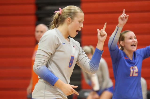 Branford hitter Anabella Dicks (left) and libero Ava Alcorn (right) celebrate a point against Fort White on Sept. 22. (PAUL BUCHANAN/Lake City Reporter)