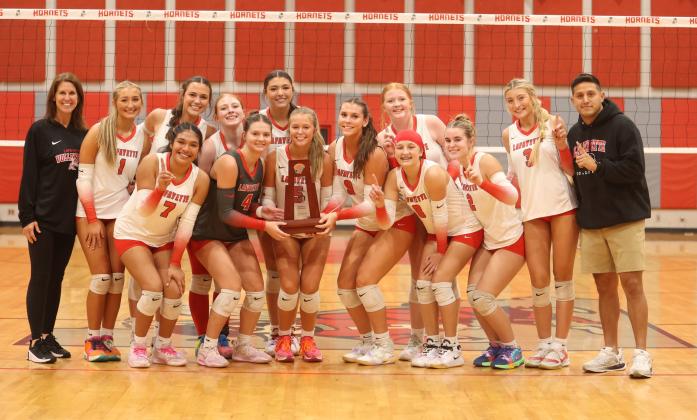 Lafayette poses with its District 5-R championship trophy after its 3-1 win over Aucilla Christian on Thursday. (MORGAN MCMULLEN/Lake City Reporter)