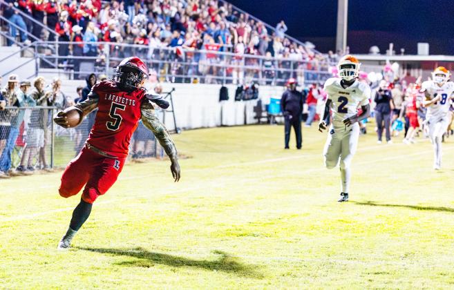 Lafayette running back Zamarion Hawkins scores a touchdown against Branford on the Hornets’ first possession Friday night. (JACK HOWDESHELL/Lake City Reporter)