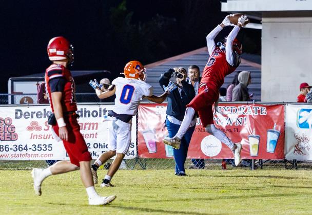 Lafayette receiver Coy Plunkett makes a leaping catch in the back of the end zone for a touchdown in front of Branford defender Colby Beard on Friday. (JACK HOWDESHELL/Lake City Reporter)