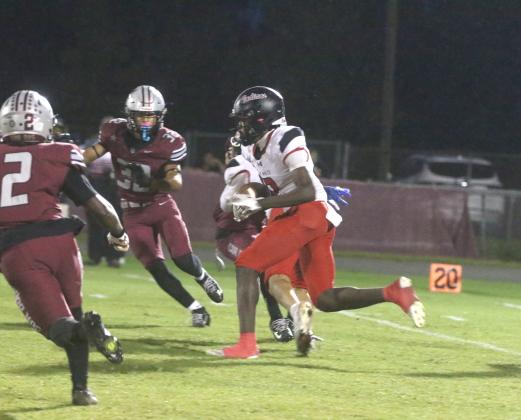 Fort White's Marvion Wallace takes the opening kickoff back 75 yards for a touchdown in the Indians' 42-26 loss to Madison County on Thursday. (MORGAN MCMULLEN/Lake City Reporter)
