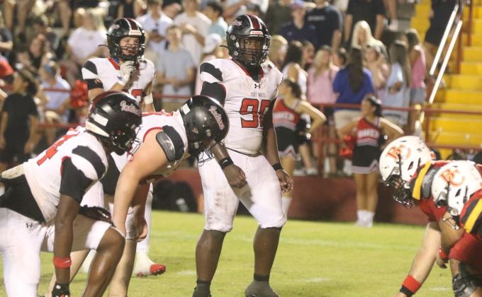 Fort White defensive tackle Jaden McCray lines up for a snap during Friday’s loss to Baker County. (MORGAN MCMULLEN/Lake City Reporter)