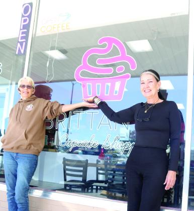 Inga Dwyer, the Toys for Tots coordinator for Columbia and Lafayette counties (left) and Sharon Ortiz, the owner of SB Clothing, stand outside Brittany’s Cupcake Shoppe ahead of the inaugural Reindeer Drop Toys for Tots fundraiser at the shop on Friday. (TONY BRITT/Lake City Reporter)