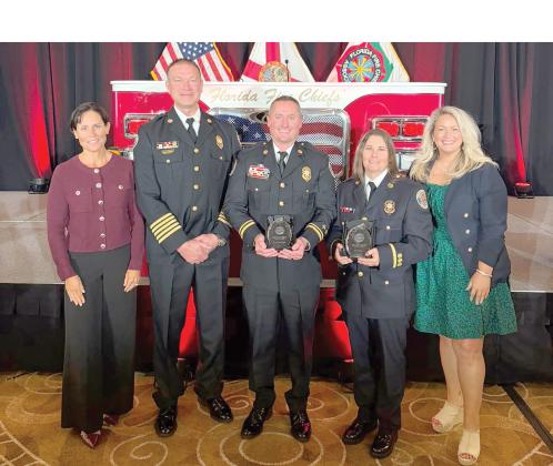 Suwannee County Fire Rescue Lt. Mica Taylor (second from right) and Capt. Chip Leathlean (center) were awarded the Florida Fire Chiefs Assocation’s Safety, Health, and Wellness Award of Excellence last week for their role in establishing the SCFR’s Peer Support Team to provide mental and emotional health support to fellow first responders. (COURTESY)