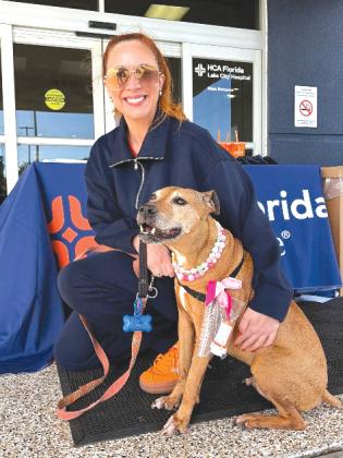 Mila, accompanied by her owner Kathryn Collins, helps make the community safer by dropping off her unused medication during HCA Florida Lake City Hospital’s Crush the Crisis prescription drug take-back event. (COURTESY) 
