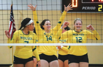 Former FGC volleyball players celebrate after a point in 2018. FGC said Friday that volleyball will return for the 2027 season after shutting down in 2021. (FILE)