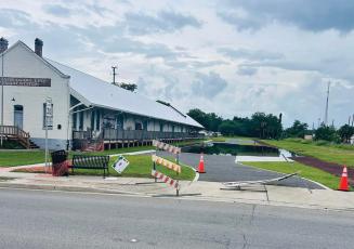 Water sits on top of the parking improvements at the Heritage Square redevelopment area on Tuesday after recent rains. The flooding is due to the project not yet being finished, according to city staff. (COURTESY)