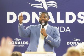 Byron Donalds, a U.S. Representative who is running for governor of Florida, speaks Saturday at a rally in Mason City. (JAMIE WACHTER/Lake City Reporter)