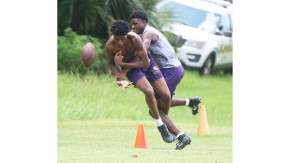 Columbia defensive back Monterrence Williamson breaks up a pass intended for receiver Shaheed White in 7-on-7 drills during Tuesday’s summer workout. (JORDAN KROEGER/Lake City Reporter)