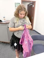 Livia Hubler works hard to check the hems on the bottom of her pajama pants. (COURTESY UF/IFAS EXTENSION COLUMBIA COUNTY)