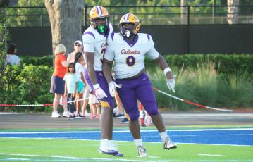 Columbia defensive tackle Jaylen Underwood (right) celebrates alongside defensive end Mikel Morgan after a sack against Bolles last Friday. (JORDAN KROEGER/Lake City Reporter)