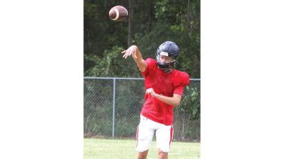 Fort White quarterback Carter Wheeler throws a pass during practice on Aug. 3. (MORGAN MCMULLEN/Lake City Reporter)