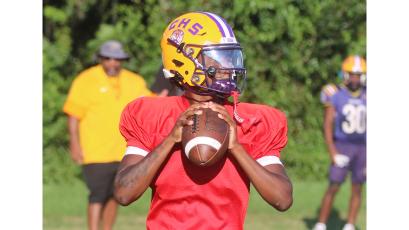 Columbia quarterback Amari Green drops back to pass during Tuesday’s practice. (JORDAN KROEGER/Lake City Reporter)