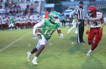 Suwannee defensive back Jarquez Gwinn returns an interception against Lafayette on Friday night. Gwinn had three interceptions in the game. (PAUL BUCHANAN/Lake City Reporter)