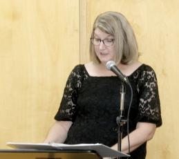 Columbia County Public Library Director Katrina Evans speaks during a previous graduation ceremony for College Online High School students through the library. The program is being relaunched thanks to a a partnership between COHS and Friends of the Library. (FILE)